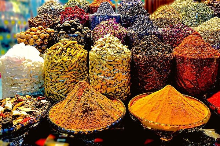 Explore a kaleidoscope of colors and fragrances at Dubai's Spice Souk where every stall offers a treasure trove of spices and exotic goods for an unforgettable shopping experience.
